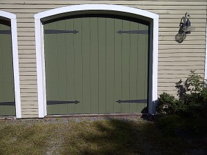 Green single residential garage door | Lewiston, ME